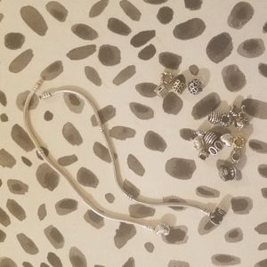 Three Pandora Bracelets + 28 Charms (including clips)